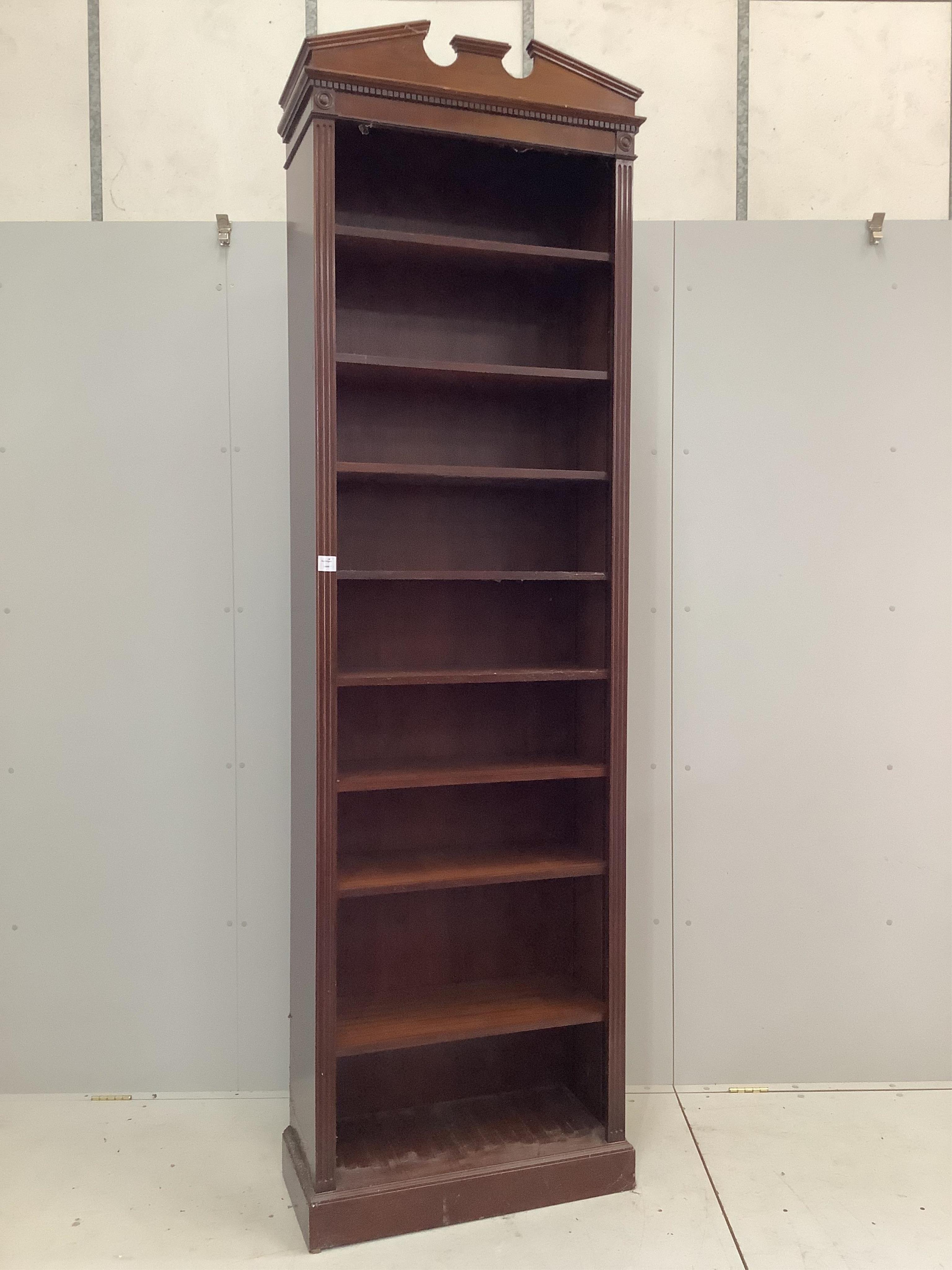 A George III style tall narrow mahogany open shelved bookcase, width 73cm, depth 33cm, height 258cm. Condition - fair